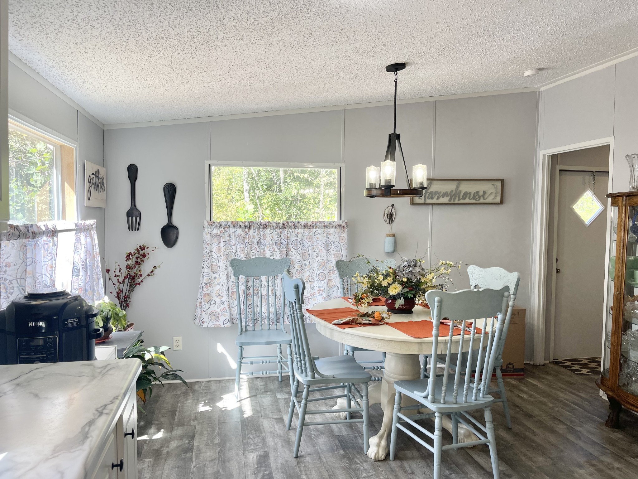 7593 Todd Road Westpoint, TN 38486 - Photo 7 of 41 a dining room with furniture a chandelier and wooden floor