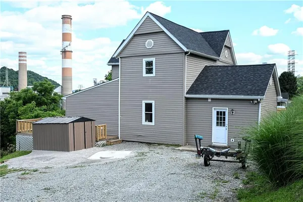 a house view with a backyard space