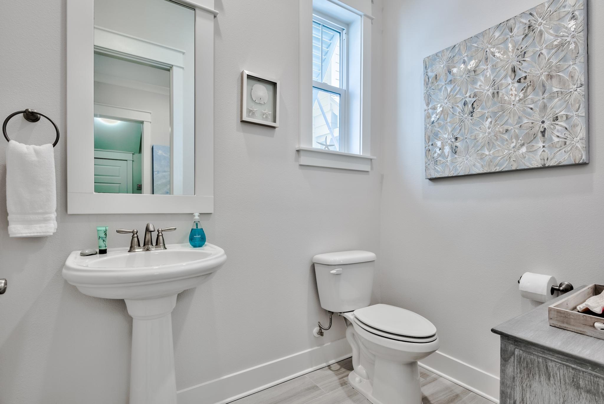 12 York Lane Inlet Beach, Unit A Inlet Beach, FL 32461 - Photo 11 of 59 a bathroom with a toilet sink and mirror
