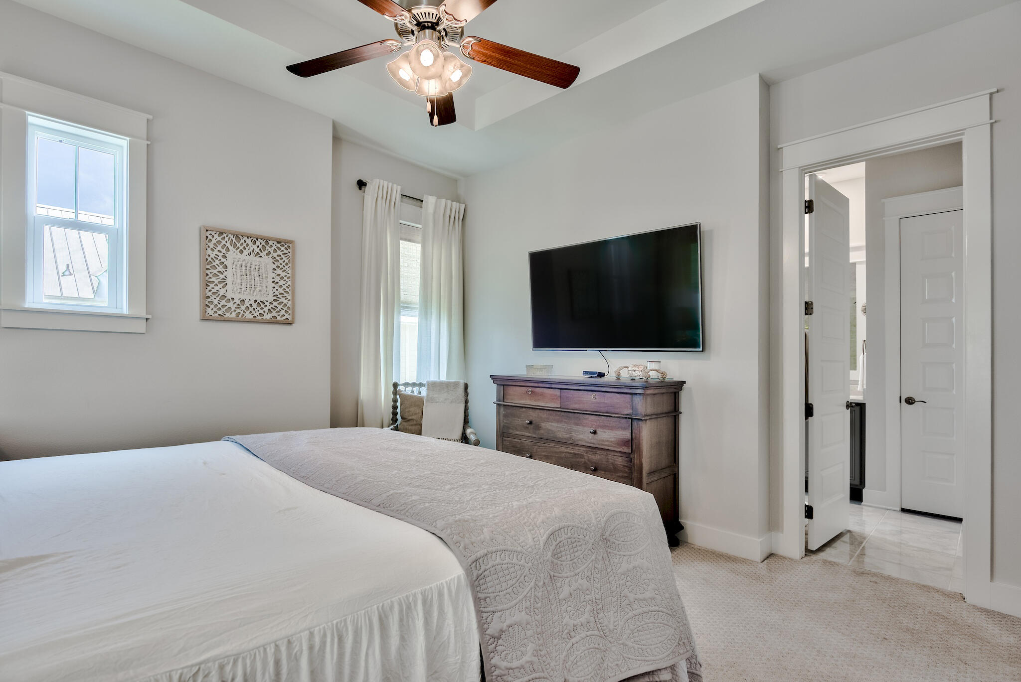 12 York Lane Inlet Beach, Unit A Inlet Beach, FL 32461 - Photo 13 of 59 a bedroom with a bed and a flat screen tv