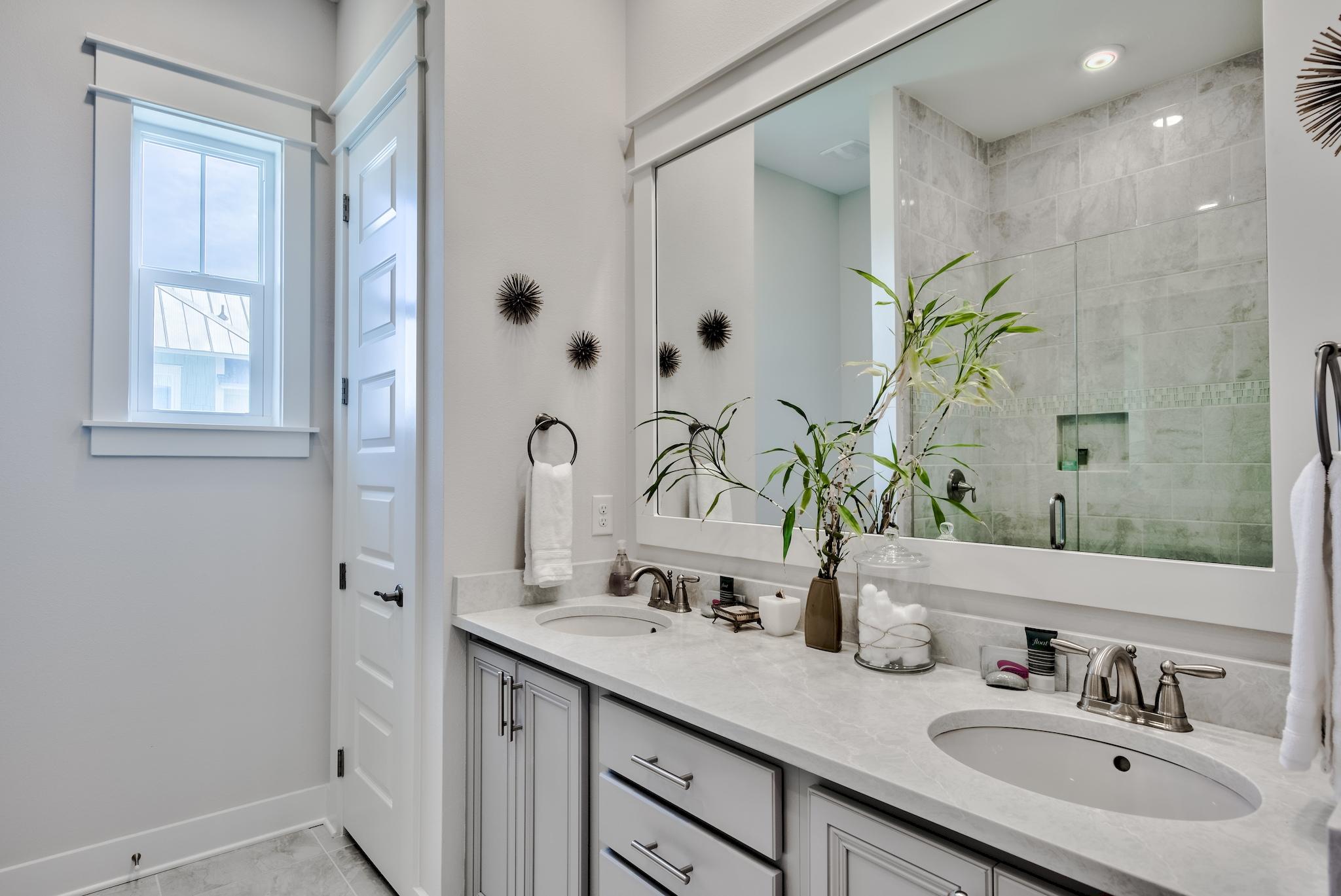 12 York Lane Inlet Beach, Unit A Inlet Beach, FL 32461 - Photo 15 of 59 a bathroom with a granite countertop sink a mirror and a shower
