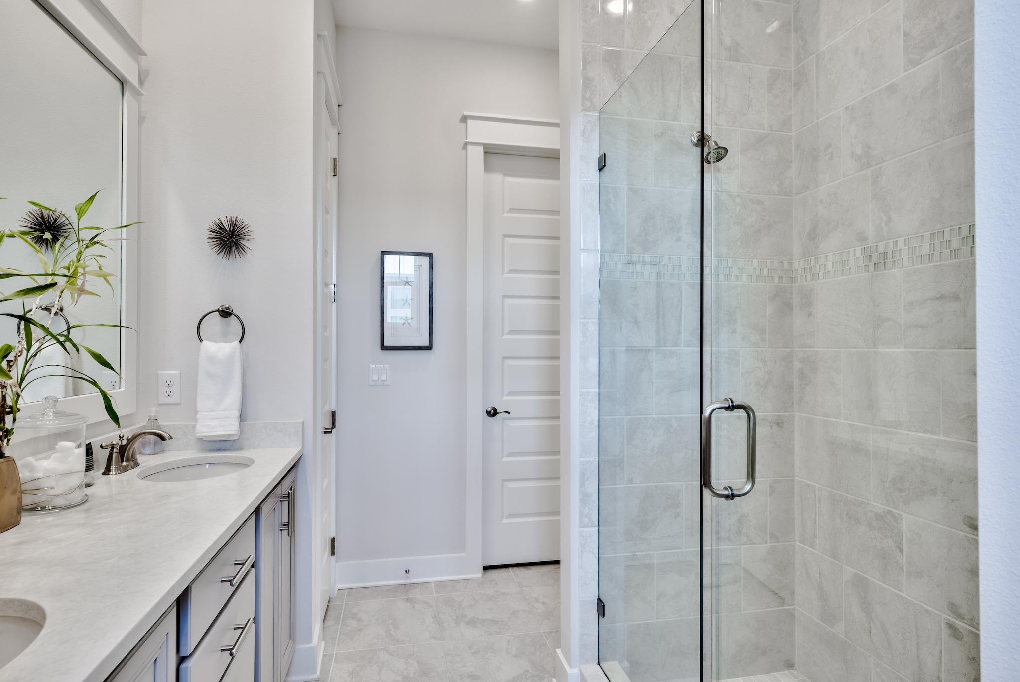 12 York Lane Inlet Beach, Unit A Inlet Beach, FL 32461 - Photo 16 of 59 a bathroom with a granite countertop sink a shower and a mirror