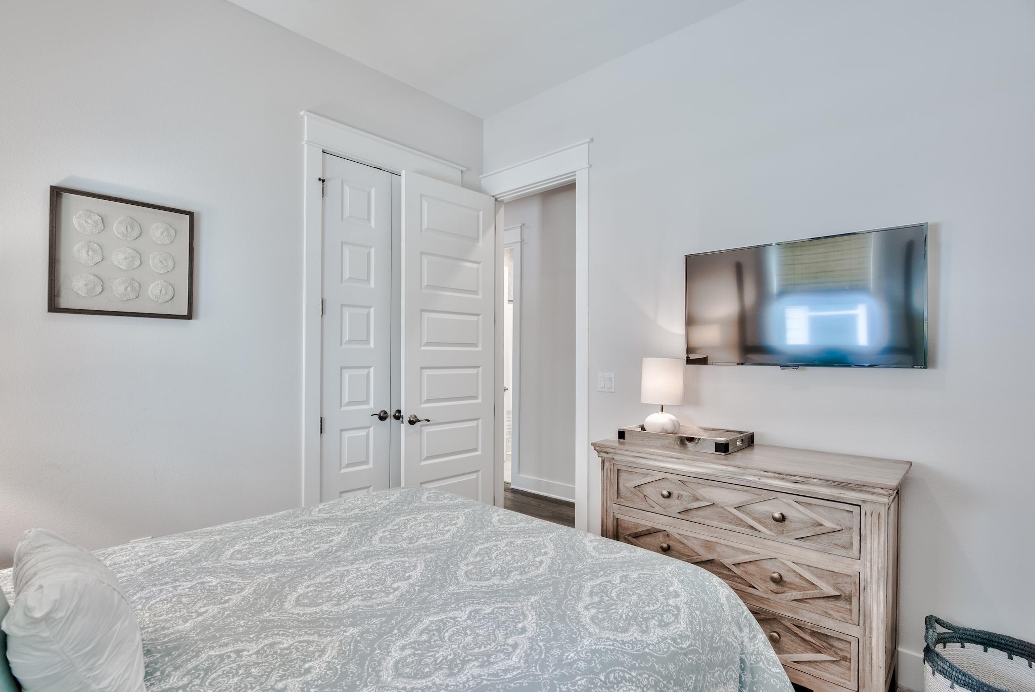 12 York Lane Inlet Beach, Unit A Inlet Beach, FL 32461 - Photo 18 of 59 a bedroom with a bed and a flat screen tv