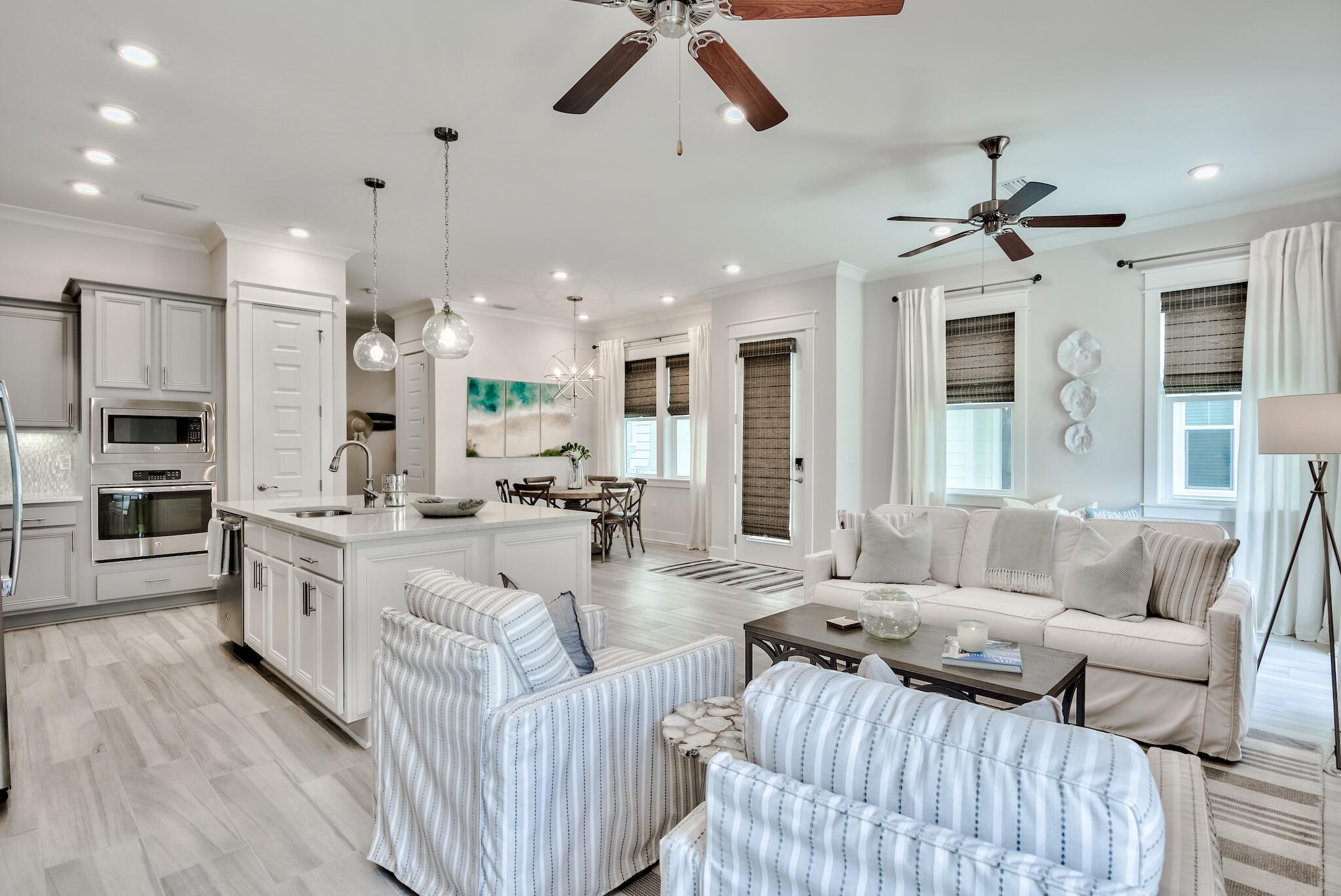 12 York Lane Inlet Beach, Unit A Inlet Beach, FL 32461 - Photo 2 of 59 a living room with furniture kitchen view and a chandelier