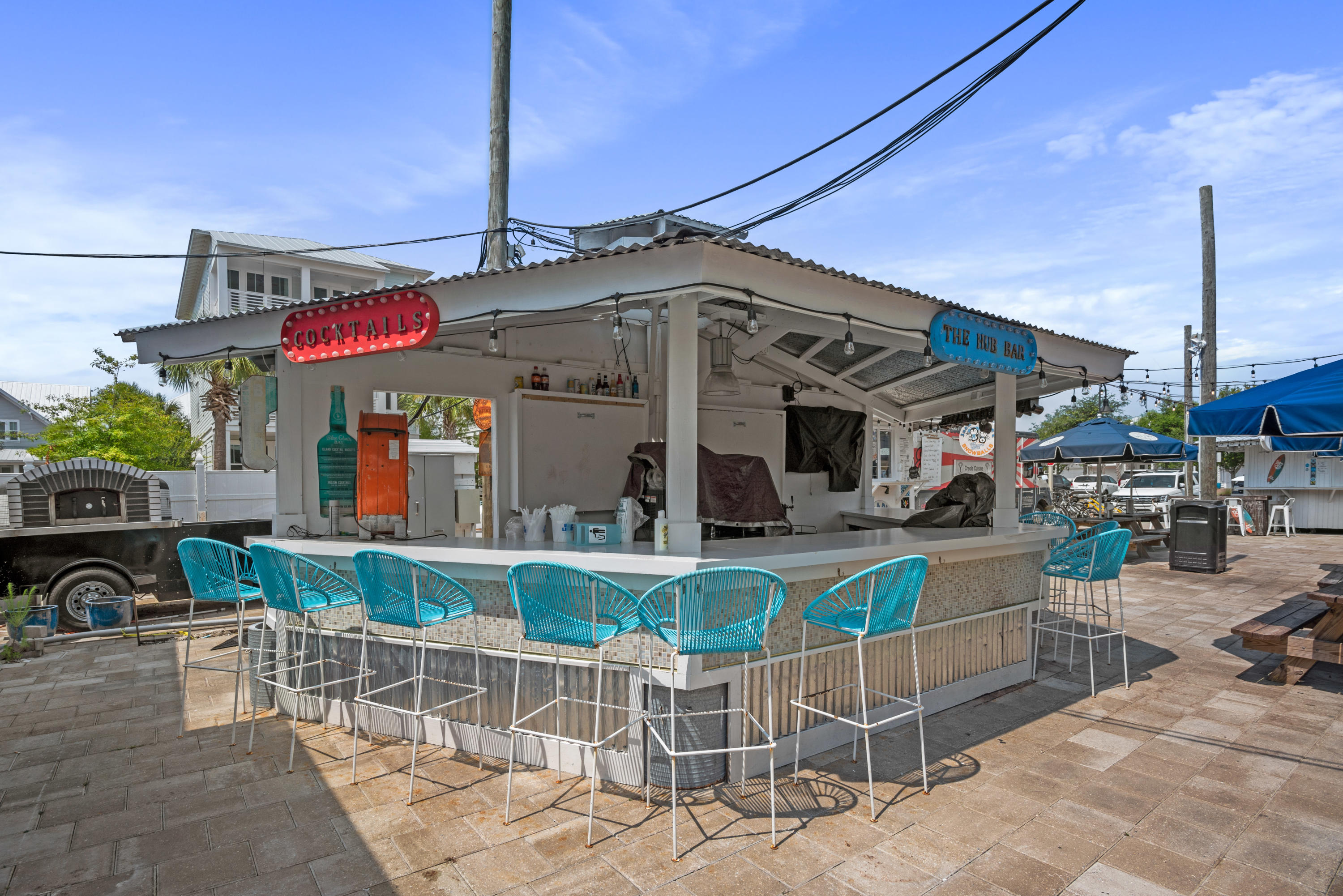 12 York Lane Inlet Beach, Unit A Inlet Beach, FL 32461 - Photo 45 of 59 a view of a patio with a table and chairs under an umbrella