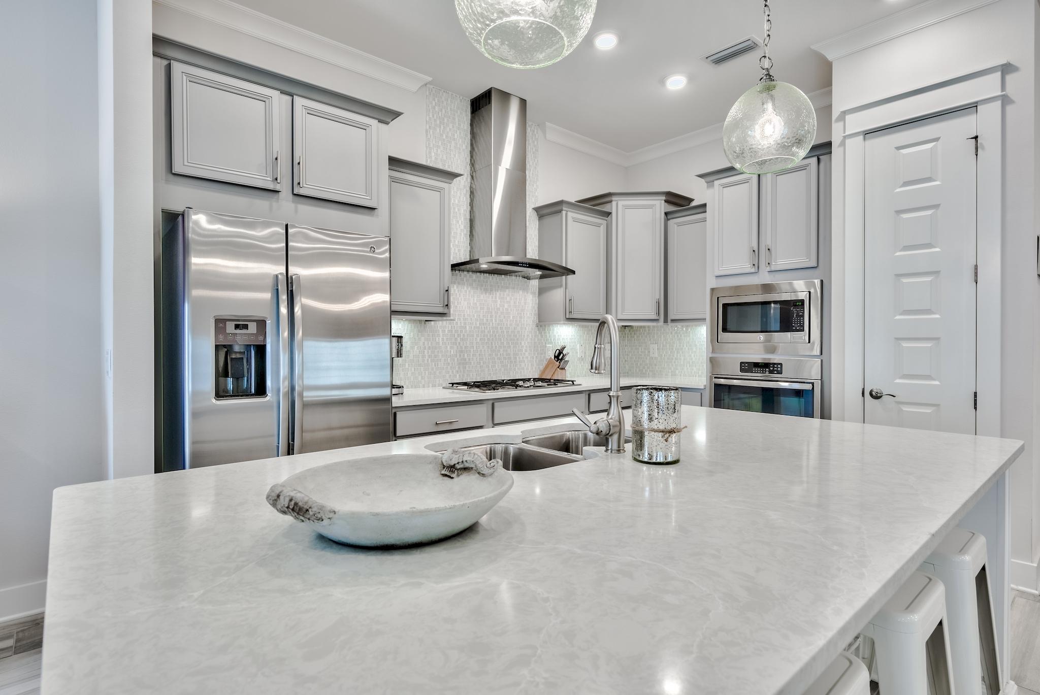12 York Lane Inlet Beach, Unit A Inlet Beach, FL 32461 - Photo 9 of 59 a kitchen with stainless steel appliances a refrigerator sink and cabinets
