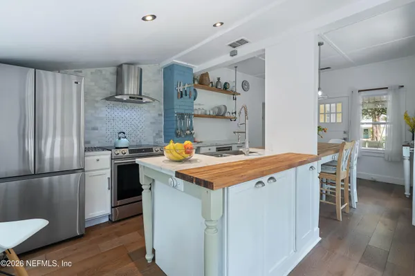 a outdoor sitting area with furniture and garden view
