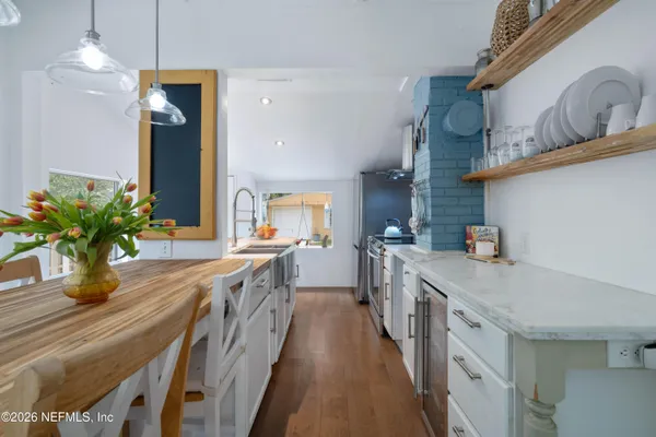 a dining room with a table and chairs in it