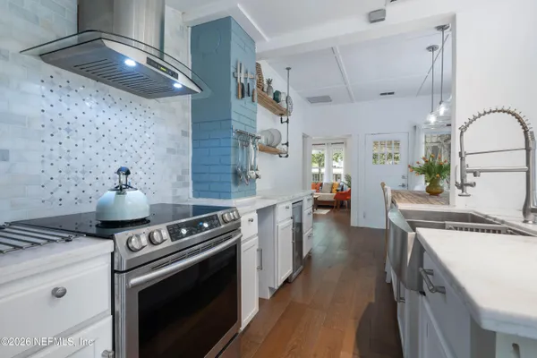 a kitchen with a stove and cabinets