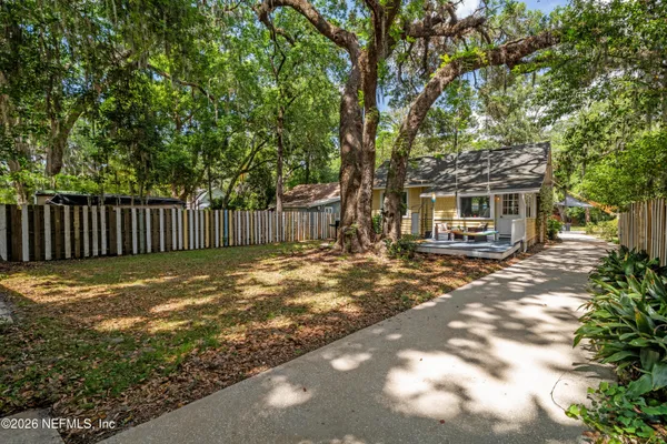 a view of a tree in a yard