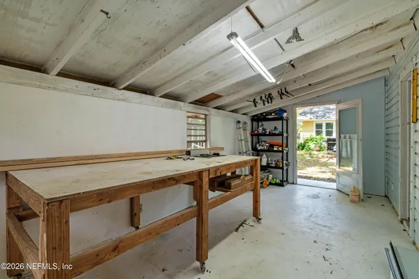 a view of a field of grass and trees