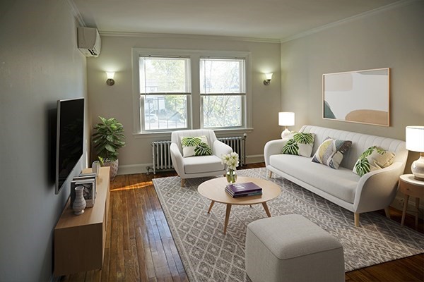 95 Adams Street, Unit 9 Waltham, MA 02453 - Photo 3 of 8 a living room with furniture and a flat screen tv
