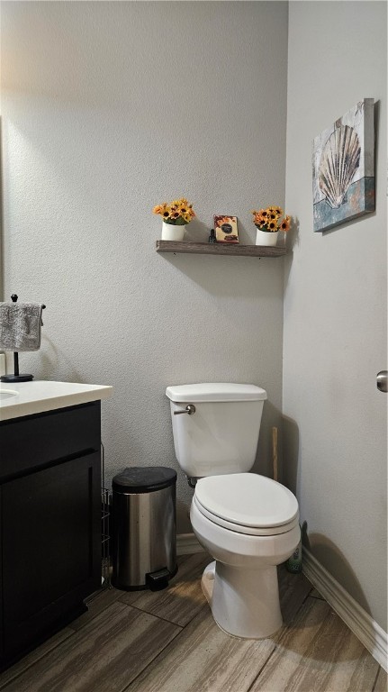 1051 Ocean Breeze Portland, TX 78374 - Photo 13 of 37 a white toilet sitting next to a bathroom sink