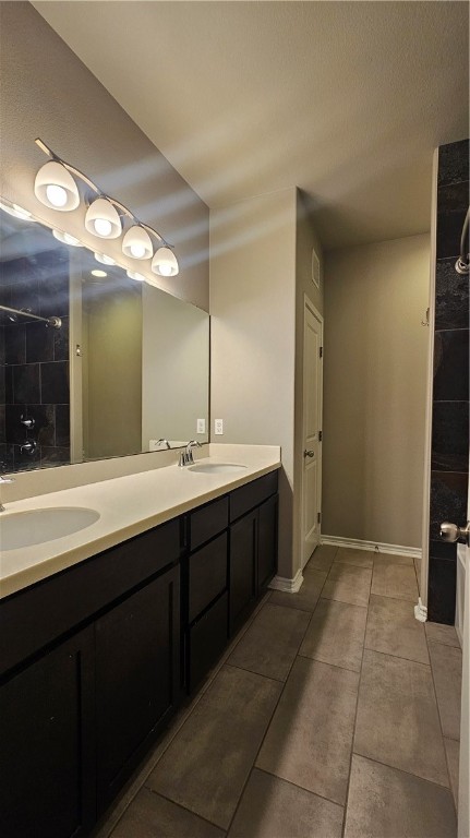 1051 Ocean Breeze Portland, TX 78374 - Photo 25 of 37 a spacious bathroom with a double vanity sink and a mirror