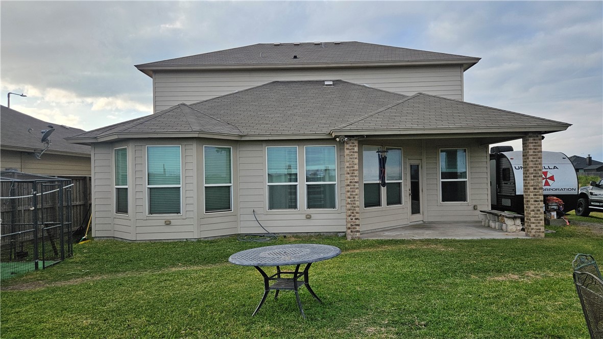 1051 Ocean Breeze Portland, TX 78374 - Photo 29 of 37 a front view of a house with garden and porch