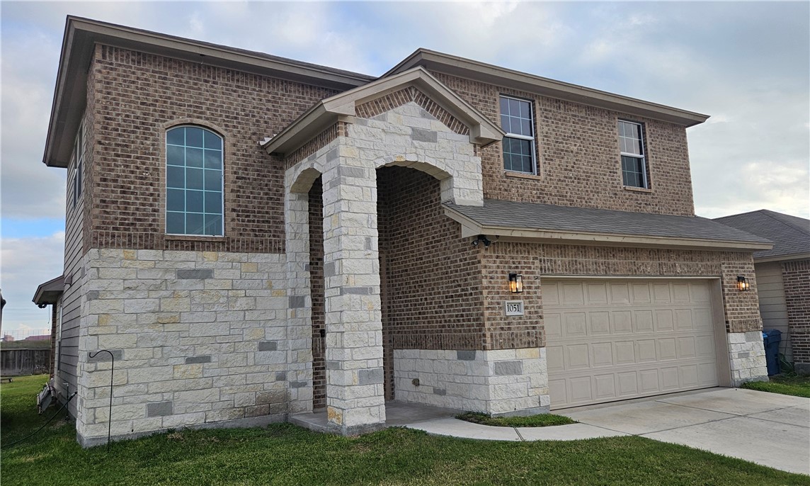 1051 Ocean Breeze Portland, TX 78374 - Photo 36 of 37 a front view of a house with a yard