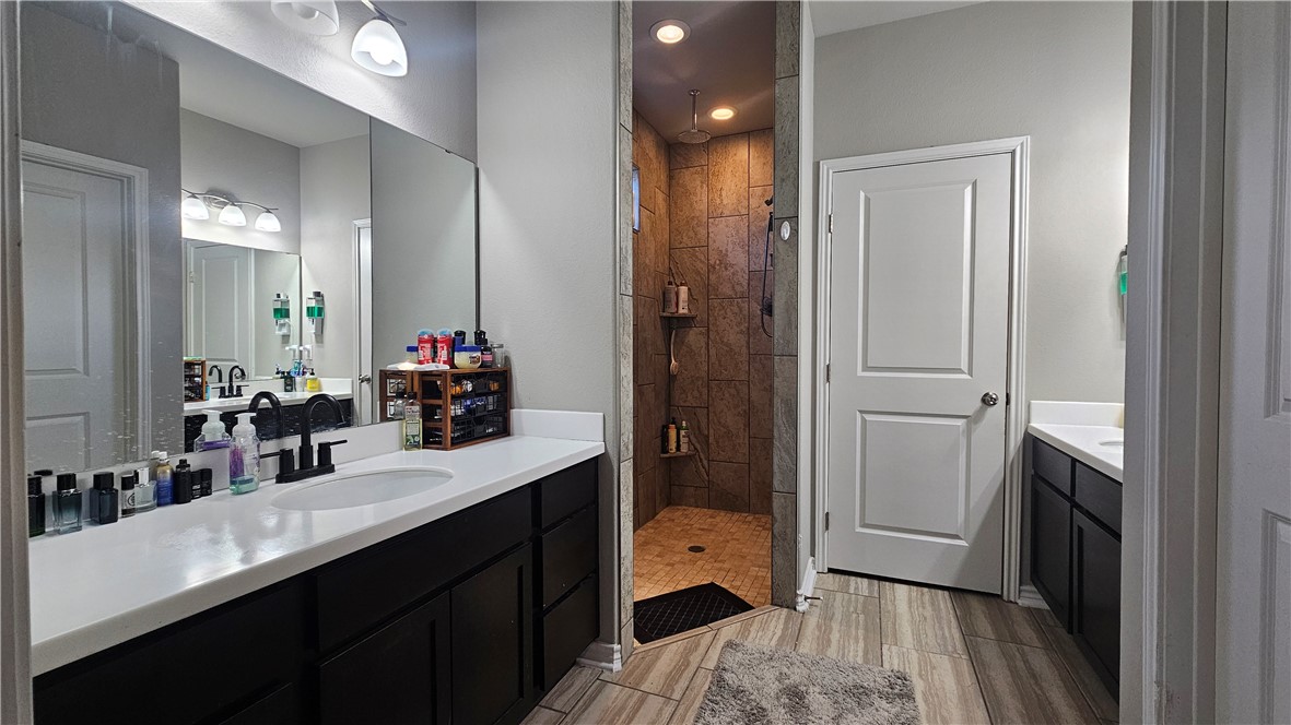 1051 Ocean Breeze Portland, TX 78374 - Photo 10 of 37 a bathroom with a sink and a mirror