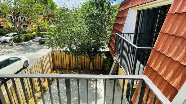 a view of deck with wooden floor and fence
