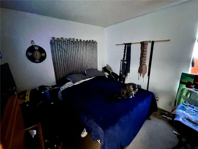 a living room with furniture and a mirror