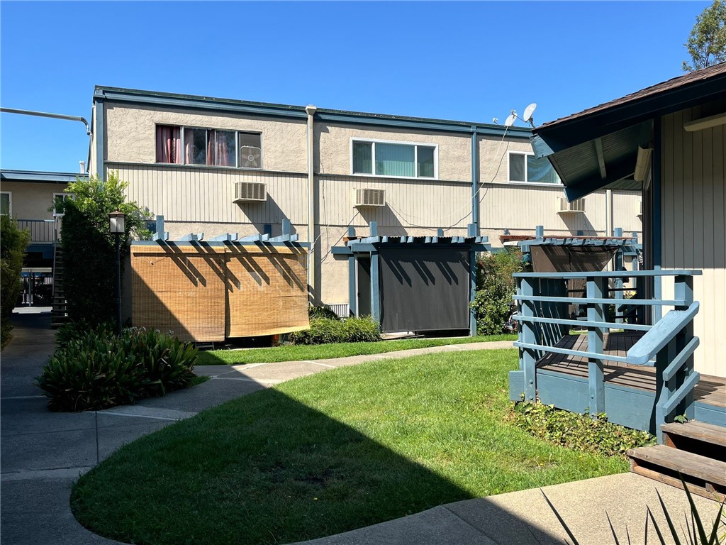 1731 Ellis Street, Unit 16 Concord, CA 94520 - Photo 16 of 20 a front view of a house with a yard