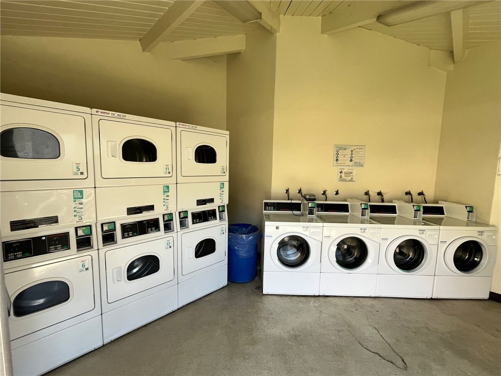 1731 Ellis Street, Unit 16 Concord, CA 94520 - Photo 18 of 20 a white house with a stove a sink and white cabinets with wooden floor