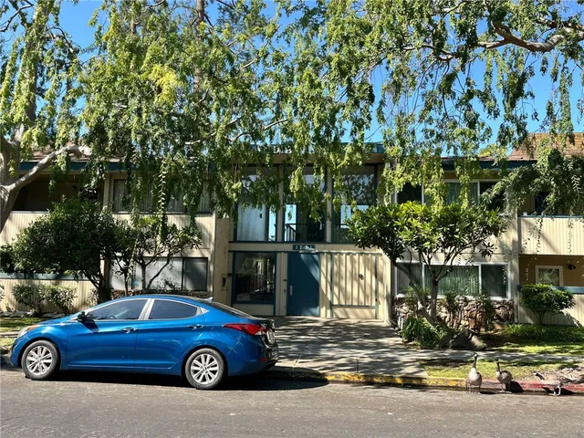 a car parked in front of a house
