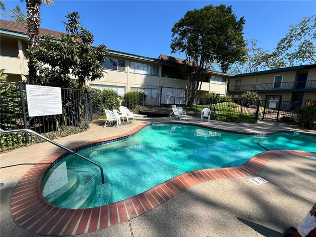 a view of a backyard with sitting area
