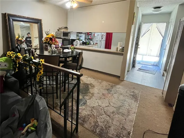 a view of a living room and dining room