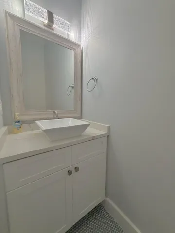 a white toilet sitting next to a shower