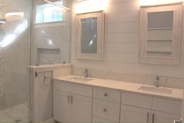 a bathroom with a bathtub and shower