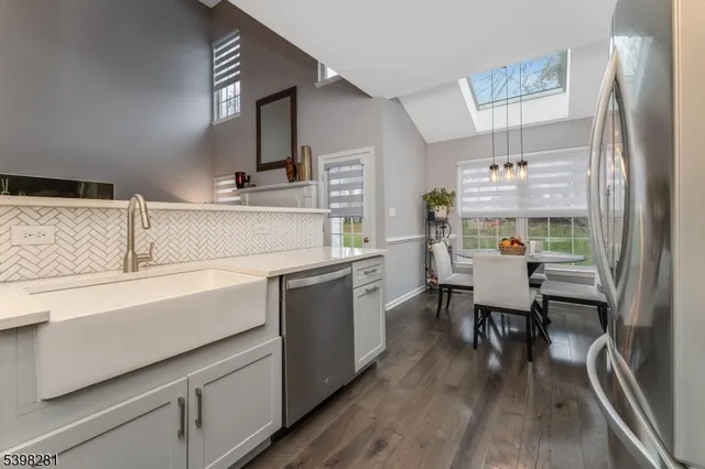 a kitchen with cabinets and stainless steel appliances