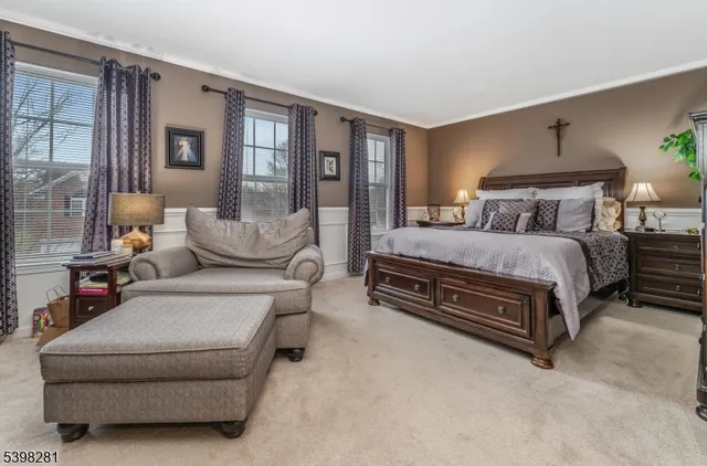 a bathroom with a tub double sink and mirror