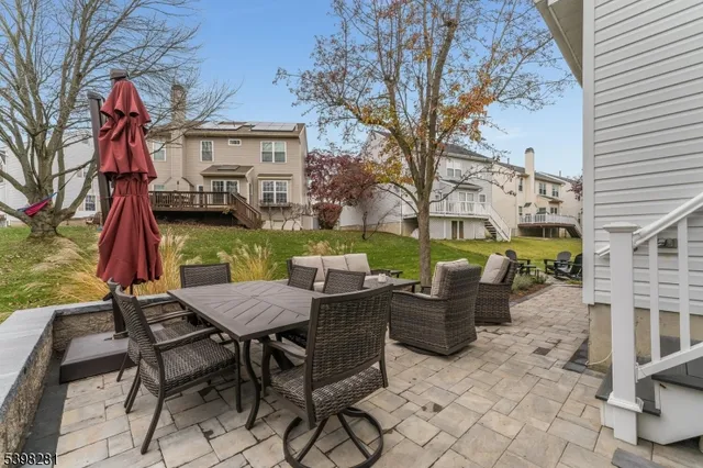 a view of a backyard with sitting area