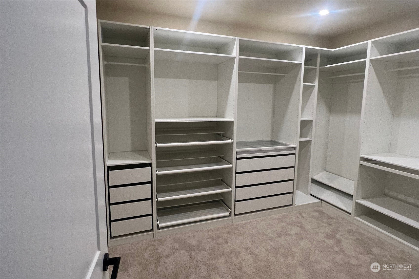 19528 22nd Avenue Southeast, Unit A Bothell, WA 98012 - Photo 21 of 33 a view of walk in closet with empty racks