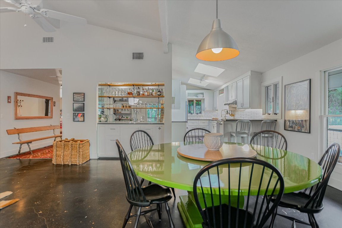1121 Hidden Valley Road Wimberley, TX 78676 - Photo 13 of 40 a view of a dining room with furniture window and outside view