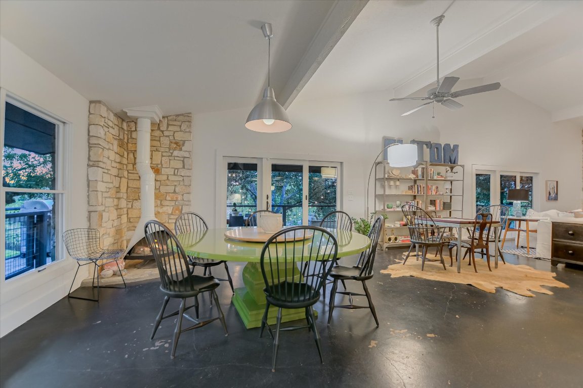 1121 Hidden Valley Road Wimberley, TX 78676 - Photo 14 of 40 a view of a dining room with furniture window and outside view