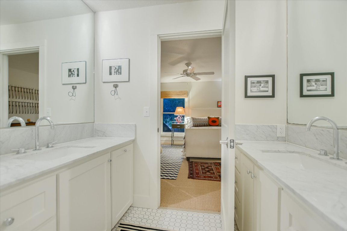 1121 Hidden Valley Road Wimberley, TX 78676 - Photo 18 of 40 a bathroom with a sink and a mirror