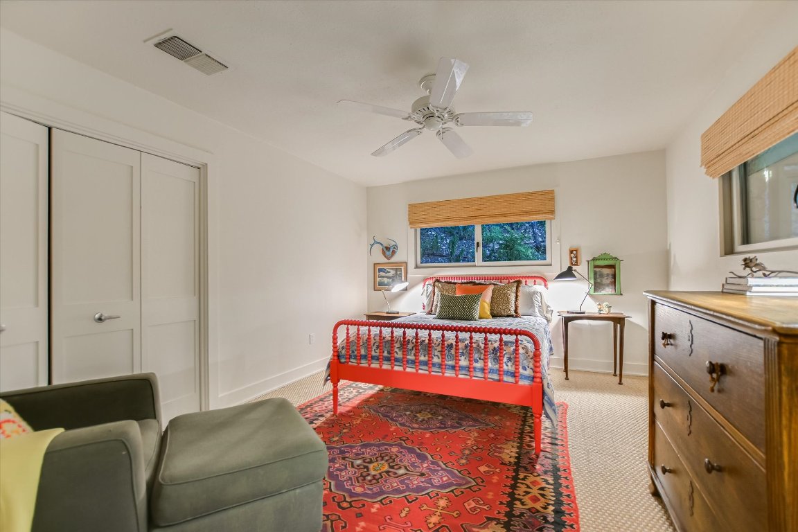 1121 Hidden Valley Road Wimberley, TX 78676 - Photo 21 of 40 a living room with furniture and a chandelier