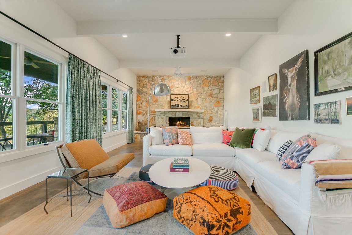 1121 Hidden Valley Road Wimberley, TX 78676 - Photo 32 of 40 a living room with furniture and a large window