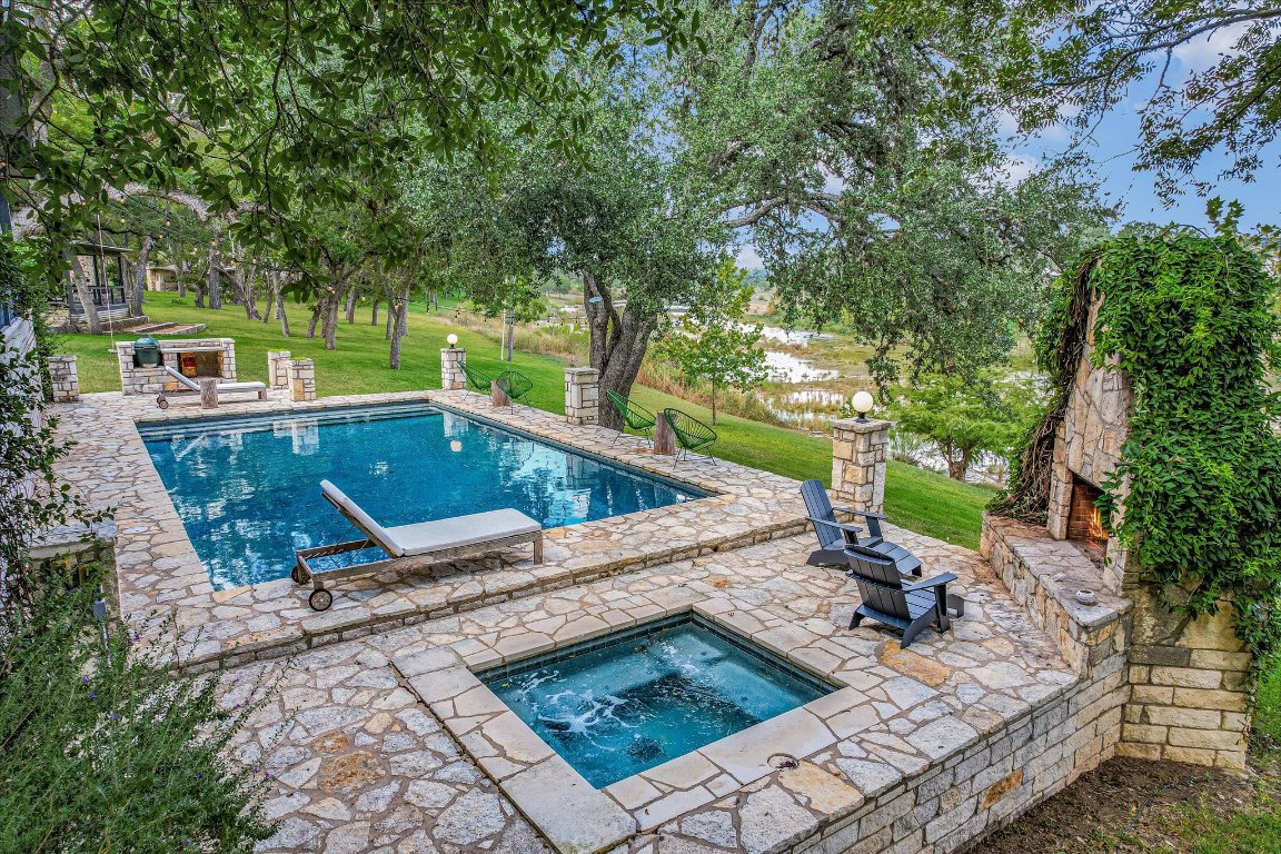 1121 Hidden Valley Road Wimberley, TX 78676 - Photo 39 of 40 a view of a backyard with sitting area furniture and a swimming pool