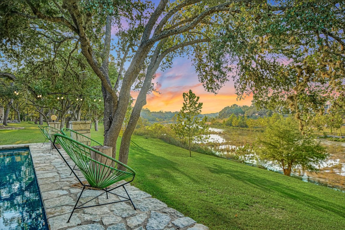 1121 Hidden Valley Road Wimberley, TX 78676 - Photo 5 of 40 a view of a lake with a garden