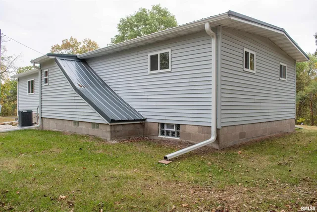 a view of a backyard space of a house