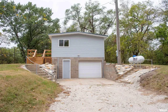 a backyard of a house with seating space