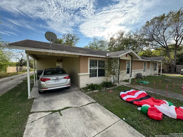 a front view of a house with sitting area