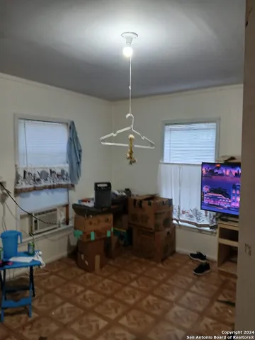 a work room with furniture and a chandelier