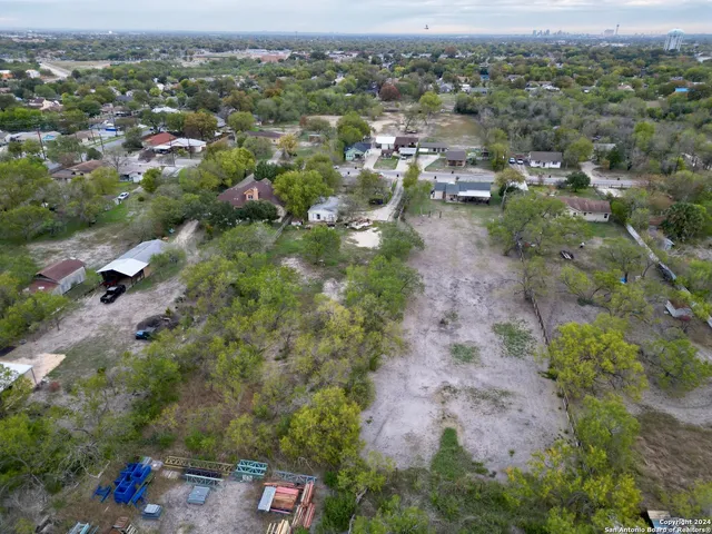 an aerial view of a town with couple of houses