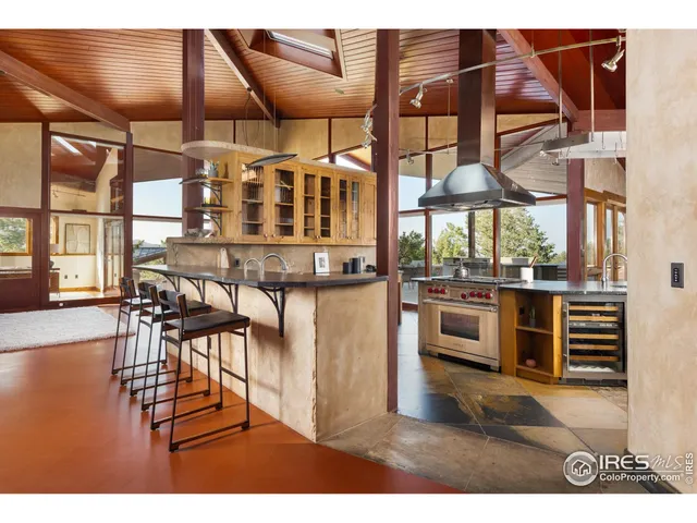 a kitchen view with table and chairs