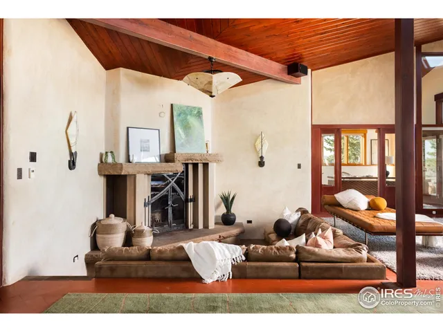 a living room with fireplace furniture and a fireplace