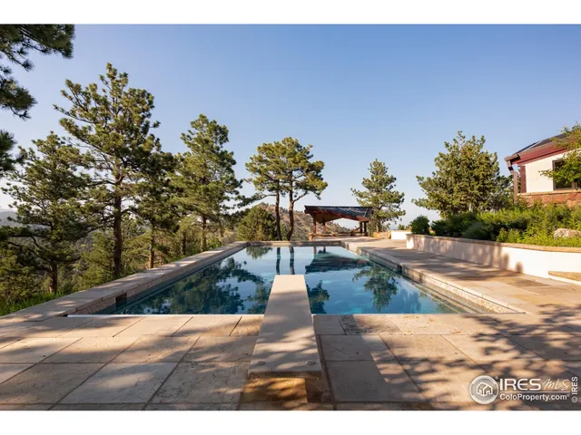 a view of swimming pool with lounge chair