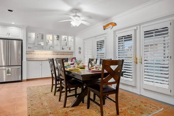 a view of a dining room with furniture and window